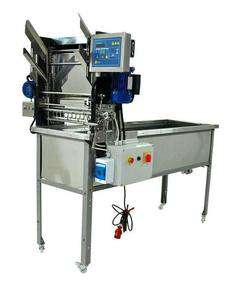 Stół do odsklepiania z podajnikiem automatycznym, 400 V, z nożami podgrzewanymi elektrycznie Stół do odsklepiania z podajnikiem automatycznym, 400 V, z nożami podgrzewanymi elektrycznie