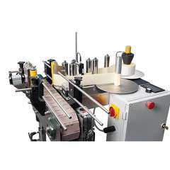 Etykieciarka do automatycznej linii do rozlewania miodu. Etykieciarka do automatycznej linii do rozlewania miodu.